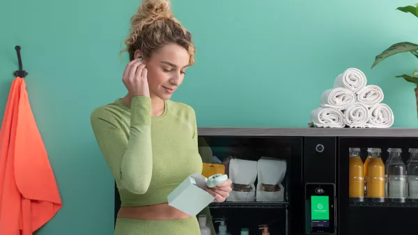 Resident using Pantra micro-market in modern apartment wellness area